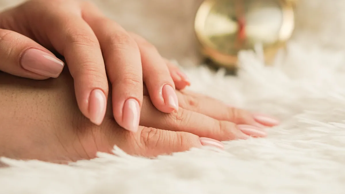 Neutral-toned manicure with squoval nail shape.